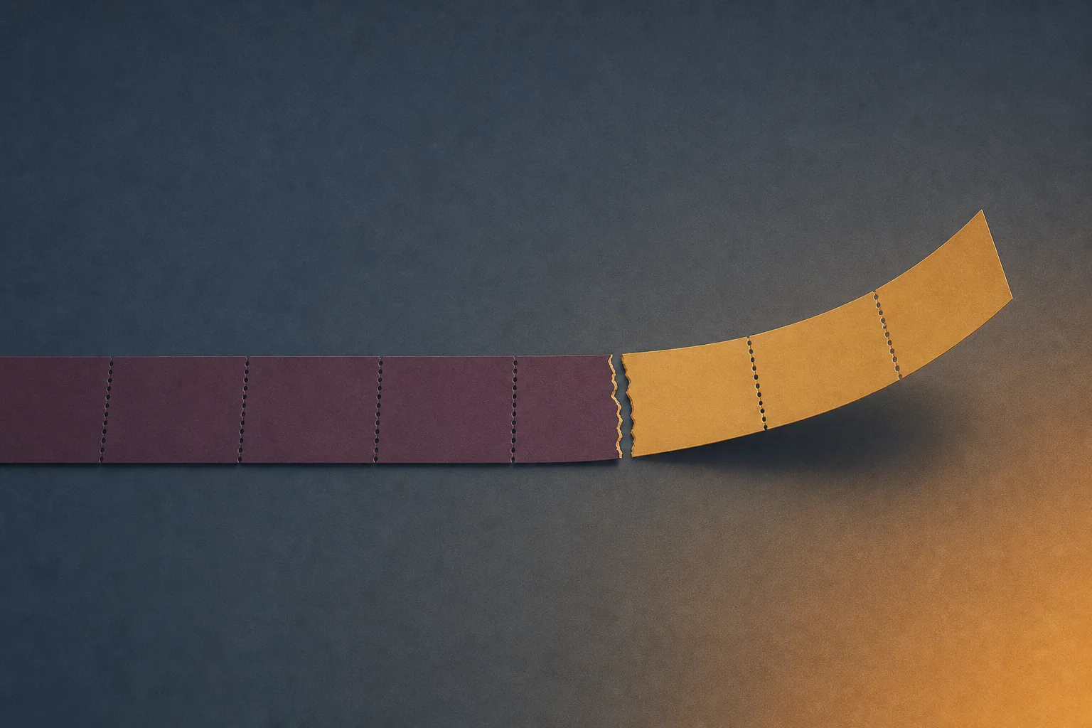 A long strip of plain paper segments torn part way along, with the torn-off length curling up and away.